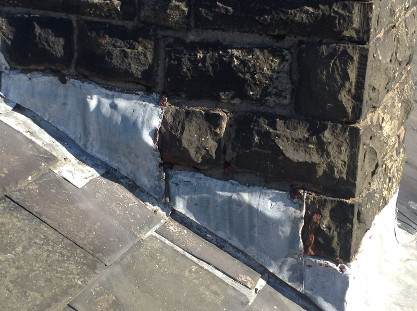 Chimney flashing before repair.