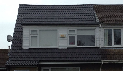 Tiled dormer windows in roof.