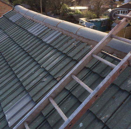 Replacing a few damaged roof tiles - P W Contractors.